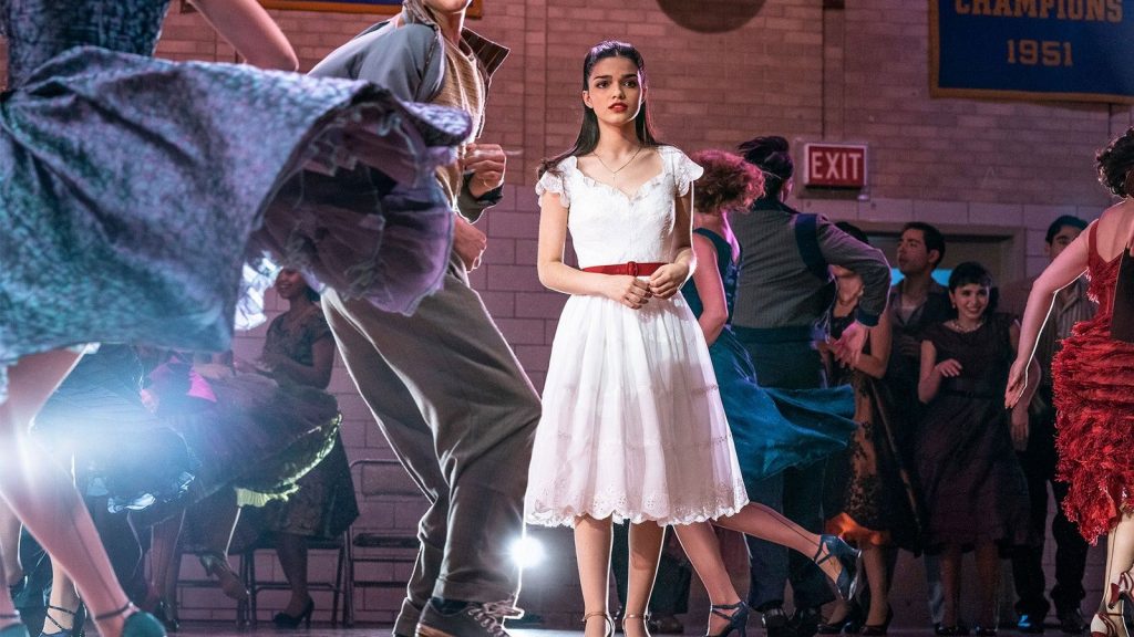 A still of Rachel Zegler as Maria in a room of dancing teenagers as seen in Steven Spielberg's West Side Story, a new adaptation scheduled with a 2021 release date from 20th Century Studios. 