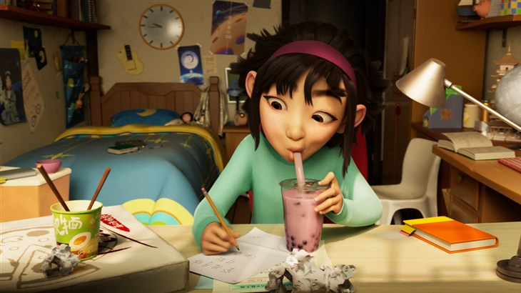 Fei Fei voiced by Cathy Ang sips boba while working on her desk in 'Over the Moon.'