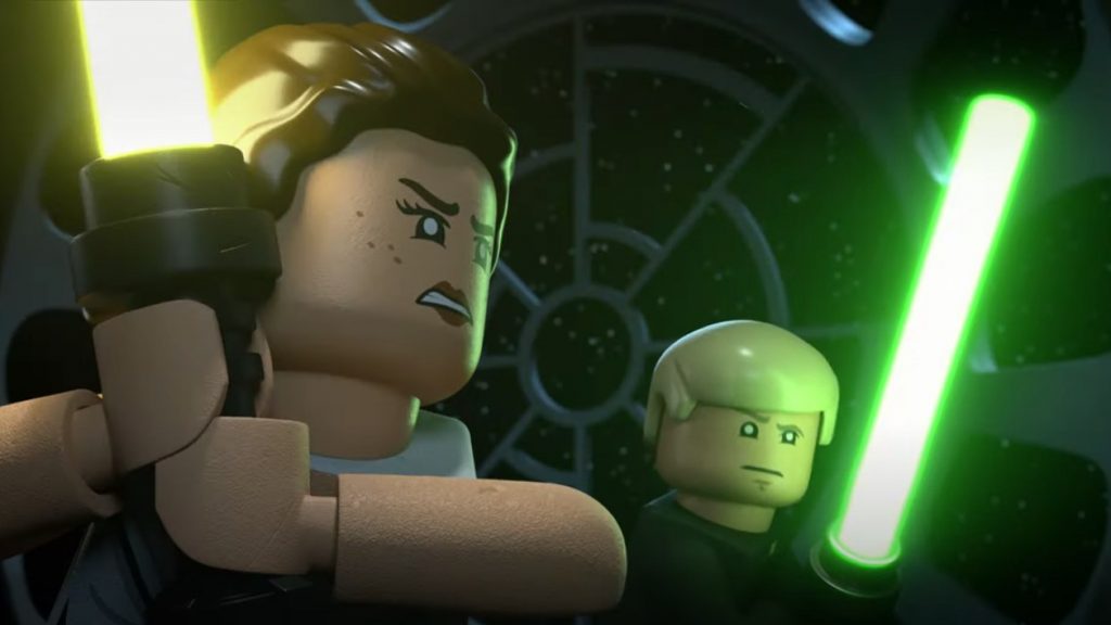 Lego Rey with her new yellow lightsaber stands by Lego Luke Skywalker with his classic green lightsaber as seen in the Lego Star Wars Holiday Special.