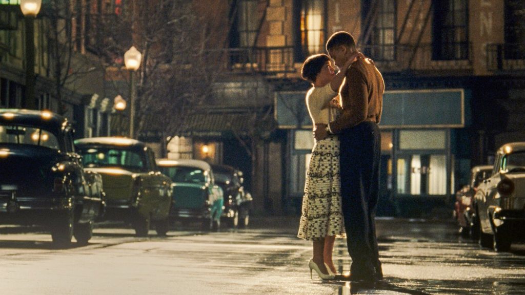 Tessa Thompson and Nnamdi Asomugha hold each other dearly in the middle of an empty Harlem street as seen in Sylvie's Love.