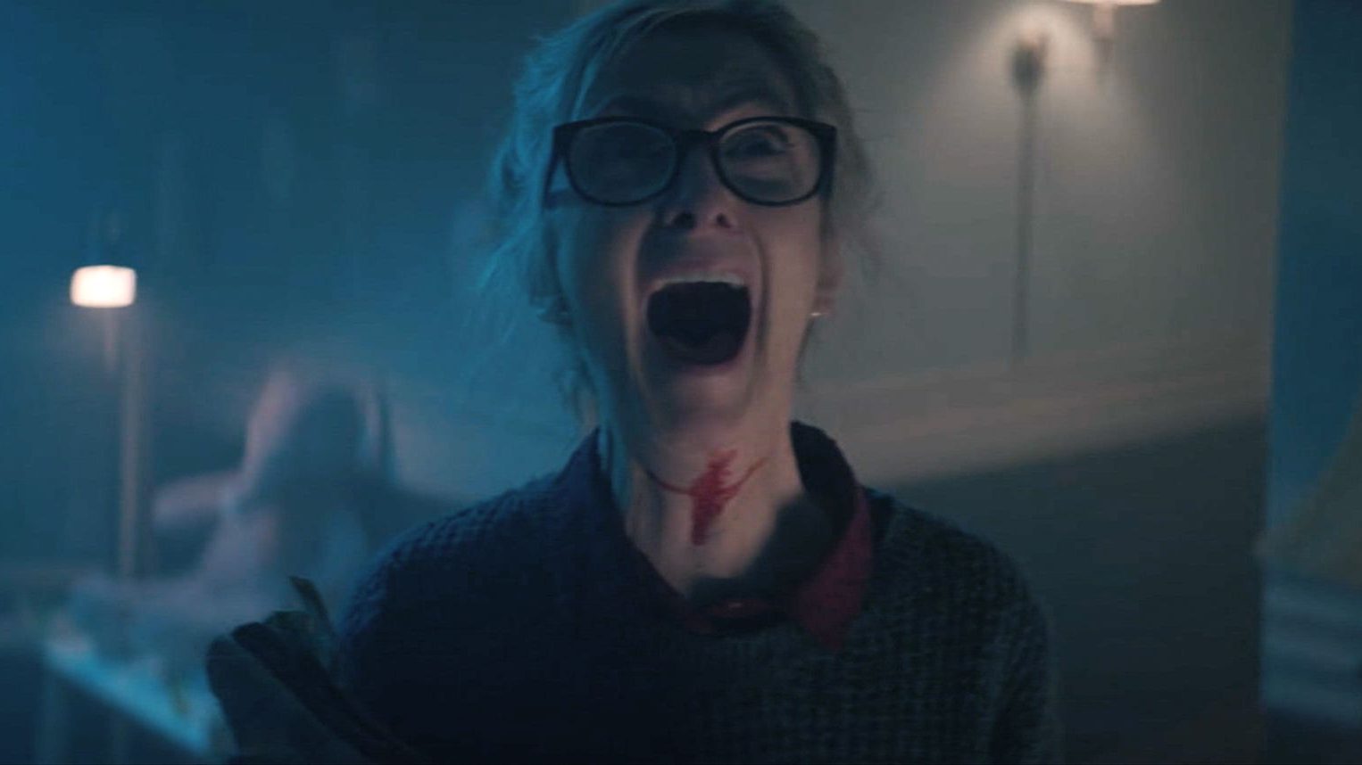 Sheila McCarthy screams for her life with blood across her neck as seen in the Shudder exclusive Anything for Jackson.