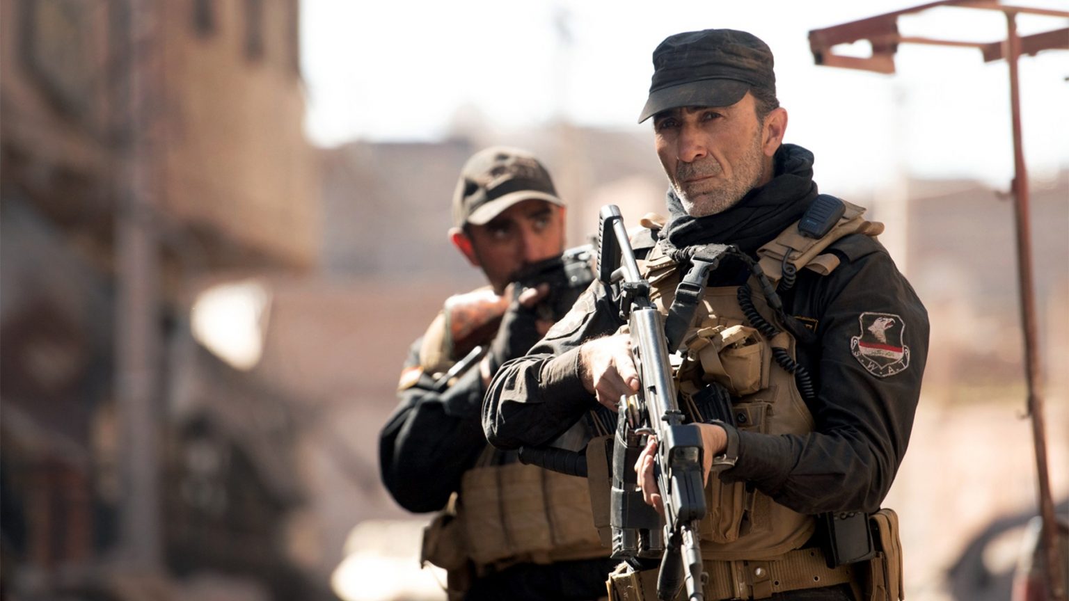 Qutaiba Abdelhaq as Kamal and Suhail Dabbach as Major Jaseem as seen in Mosul on Netflix.