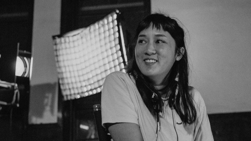 Director Kate Tsang on the set of Marvelous and the Black Hole, an official Sundance 2021 selection.