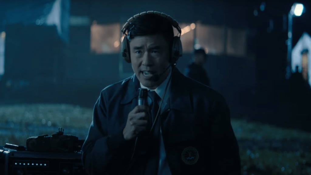 Randall Park as agent Jimmy Woo sending a radio signal in Episode 4 of WandaVision. 
