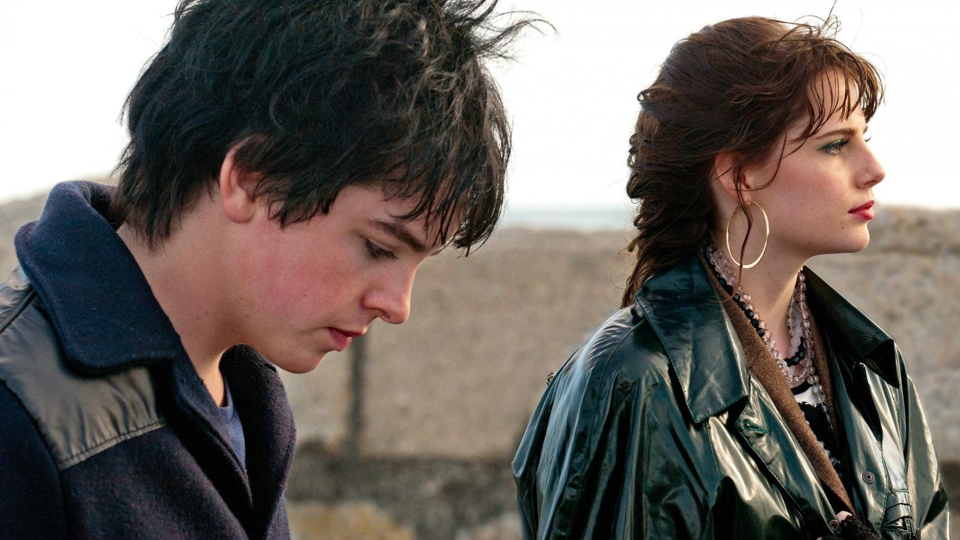 Ferdia Walsh-Peelo and Lucy Boynton looking out to sea in Sing Street