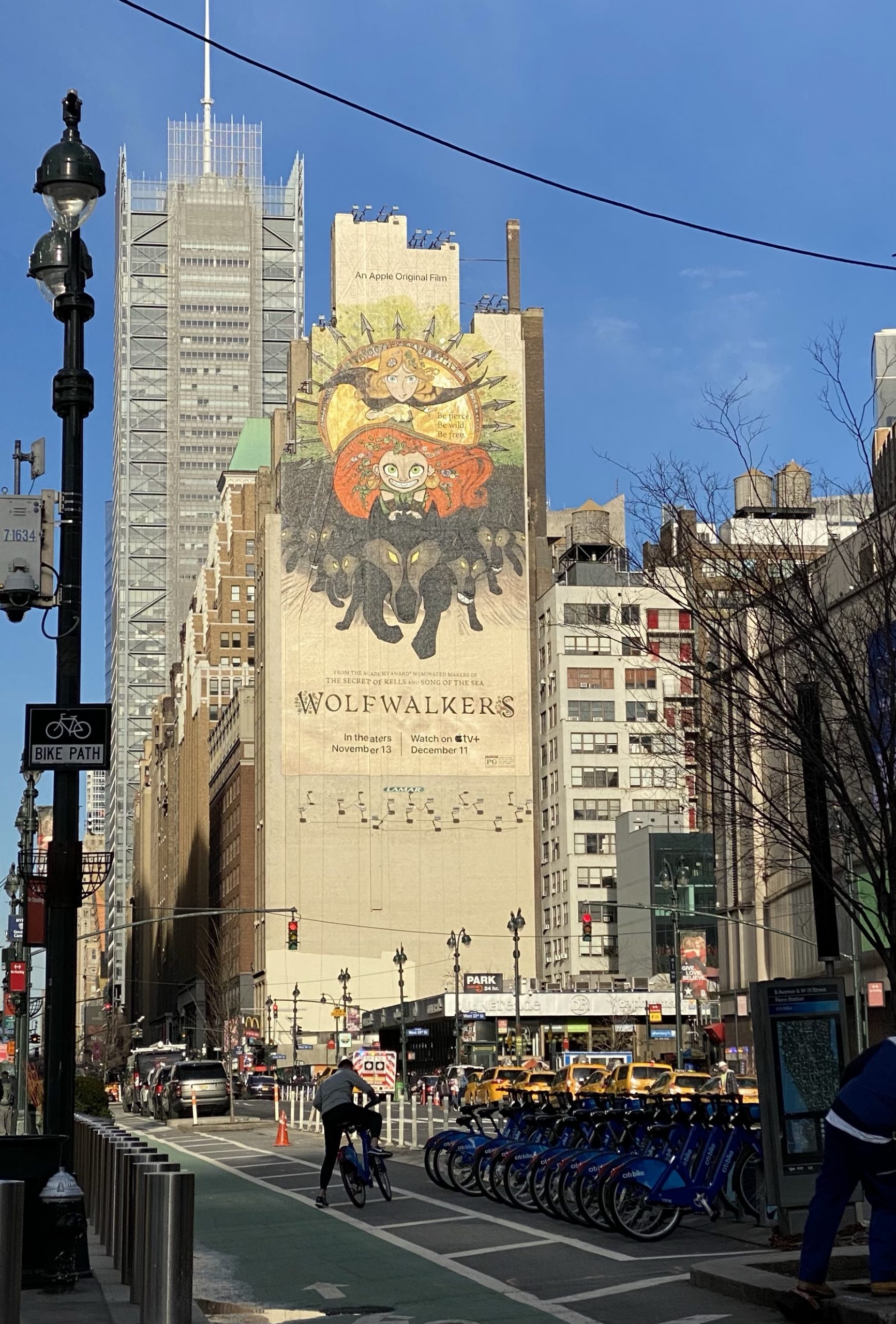 A giant mural poster for the Oscar nominated film Wolfwalkers painted on the side of a Manhattan building in New York. 