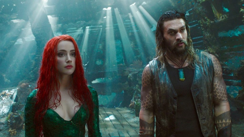 Amber Heard and Jason Momoa underwater as seen in Aquaman, both returning to film the sequel Aquaman 2 summer 2021.