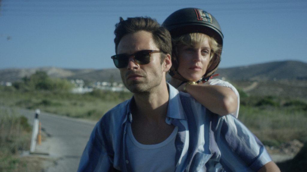 Denise Gough and Sebastian Stan riding a motorcycle together as seen in the new romantic drama Monday.