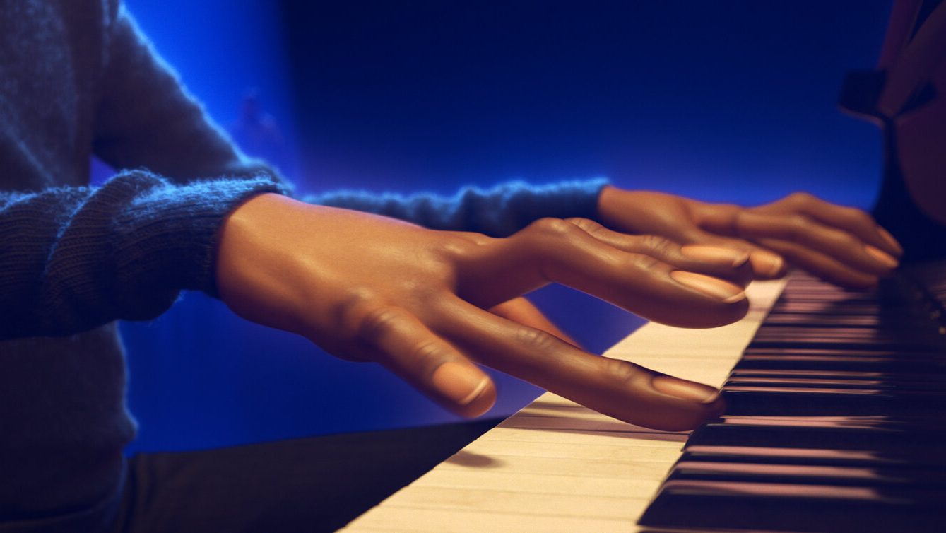 A close up of Joe Gardner voiced by Jamie Foxx playing the piano in a Jazz club as seen in the Pixar film Soul directed by Pete Docter. 