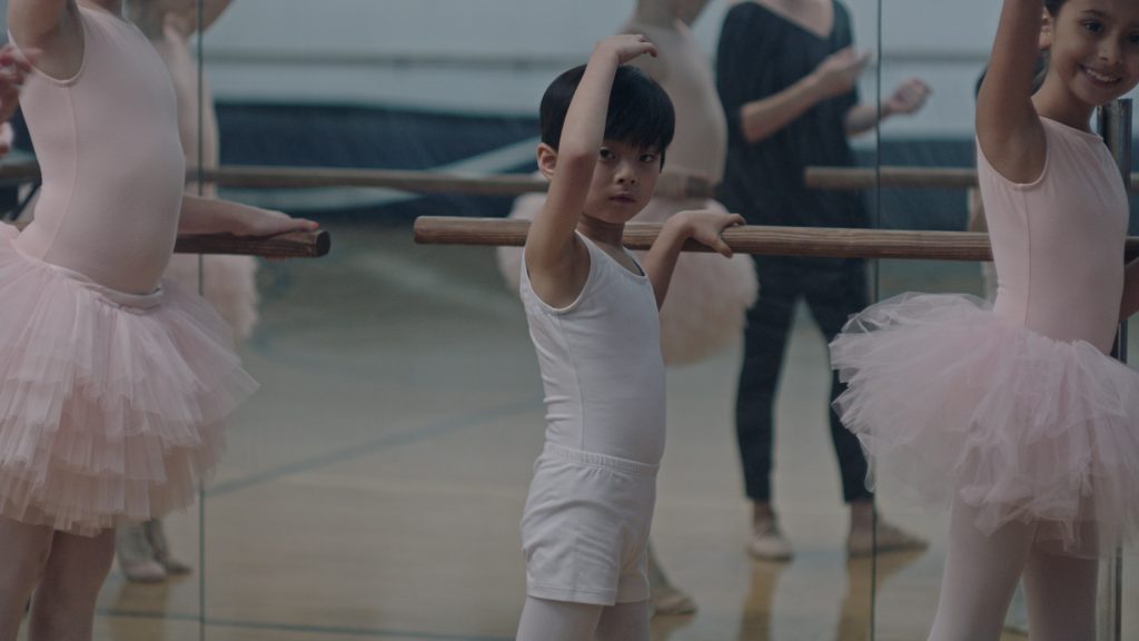 A young gender fluid Chinese boy practices ballet with young girls as seen in Little Prince(ss) part of Disney's Launchpad series. 