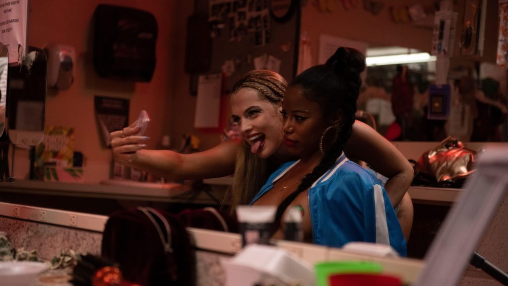 Riley Keough and Taylour Paige doing their makeup together while taking selfies as seen in the new A24 film ZOLA.