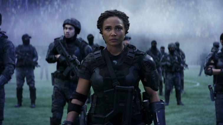 Jasmine Mathews as Lt. Hart recruits people from the present in a war for the future on a football field as seen in the new Prime Video original film THE TOMORROW WAR.