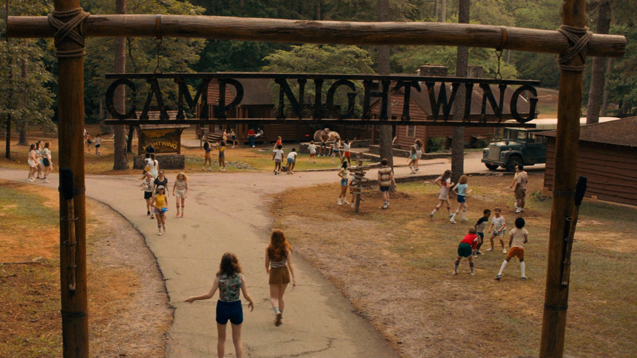 The main wooden entrance to Camp Nightwing as seen in the Netflix original horror movie FEAR STREET PART TWO: 1978.