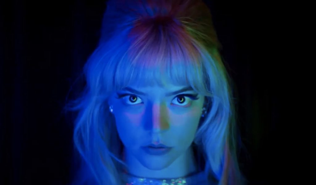 Anya Taylor-Joy in neon blue and green lighting as seen in LAST NIGHT IN SOHO directed by Edgar Wright.