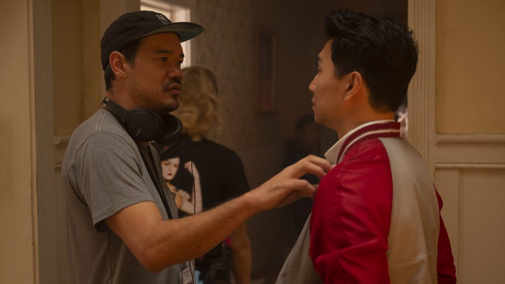 Director Destin Daniel Cretton gives notes to lead star Simu Liu on the set of Marvel Studios' SHANG-CHI AND THE LEGEND OF THE TEN RINGS.