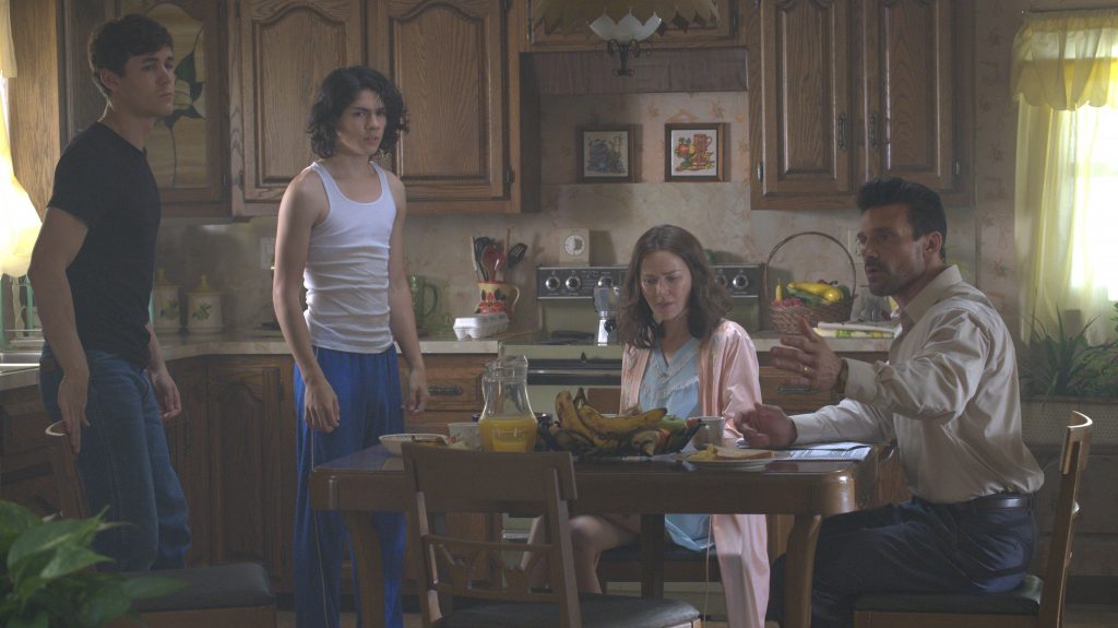 Jonah Hauer-King, Lucius Hoyos, Naomi Watts and Frank Grillo gather around the family table in THIS IS THE NIGHT directed by James DeMonaco