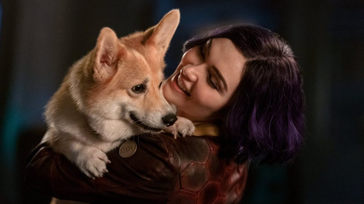 Daniella Pineda as Faye Valentine holding Ein the lovable Welsh Corgi in the Netflix live-action adaptation of COWBOY BEBOP.