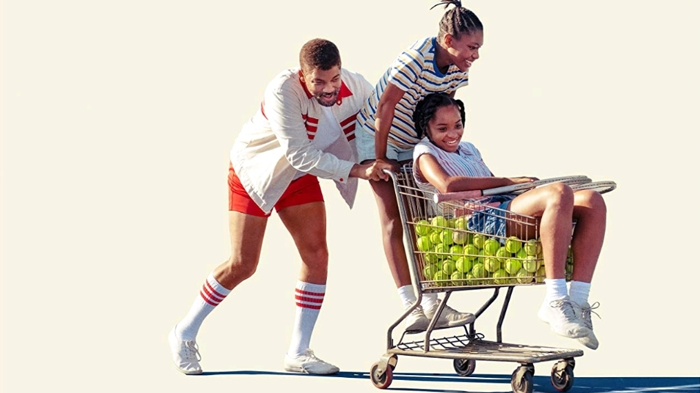 Will Smith as Richard Williams pushes his young daughters Serena and Venus Williams in a shopping cart full of tennis balls as seen on the official poster for KING RICHARD coming to HBO Max in November 2021.