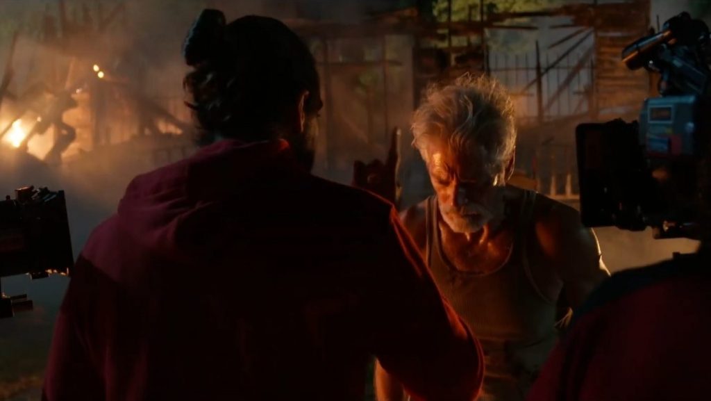 Director Rodo Sayagues points with his finger and gives direction to Stephen Lang in character as the Blind Man during an emotional scene in front of a burning house on the set of DON'T BREATHE 2. 