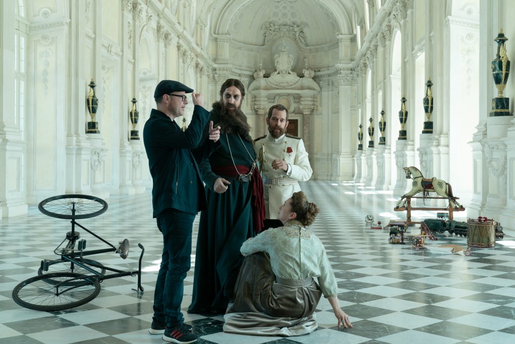Director Matthew Vaughn blocking a scene with Rhys Ifans as Rasputin on the set of THE KING'S MAN.