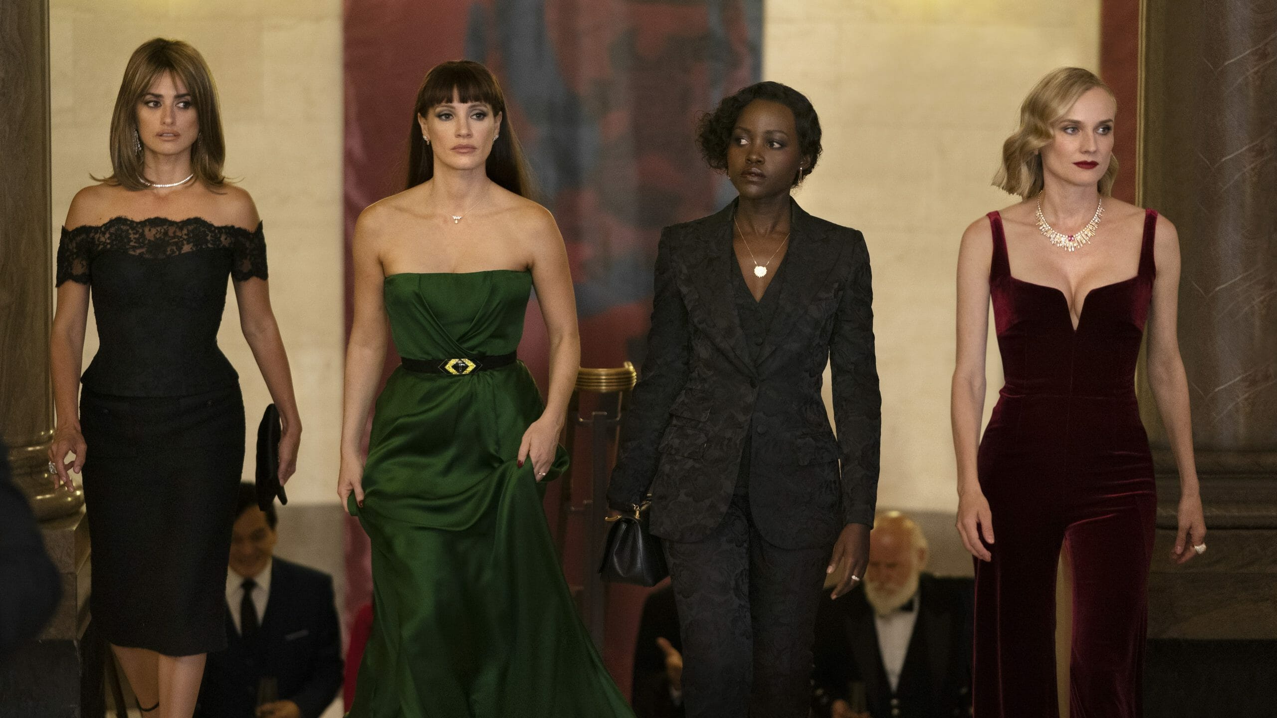 Penélope Cruz, Jessica Chastain, Lupita Nyong'o, and Diane Kruger entering a fancy ball together in disguise in the new all-female spy thriller THE 355.