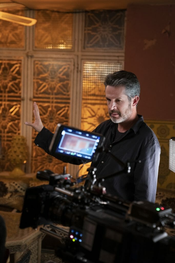Director and writer Simon Kinberg sets up a scene on the set of his all-female lead spy thriller, The 355.