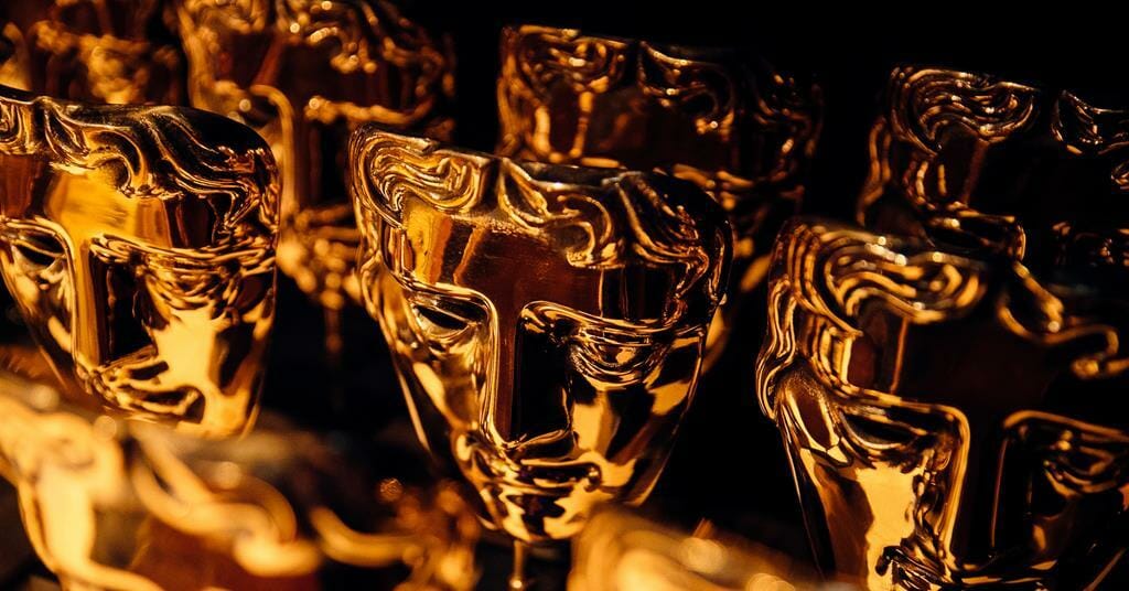 Multiple rows of the famous golden masks handed out by the BAFTAs, with the full 2022 nominations just revealed.