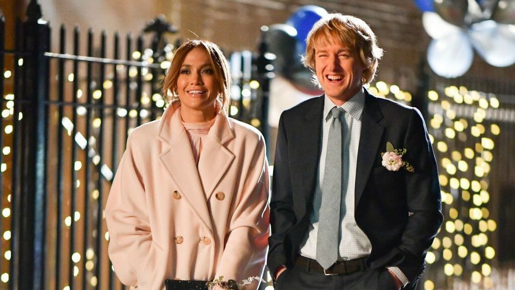 Owen Wilson and Jennifer Lopez laughing in Marry Me