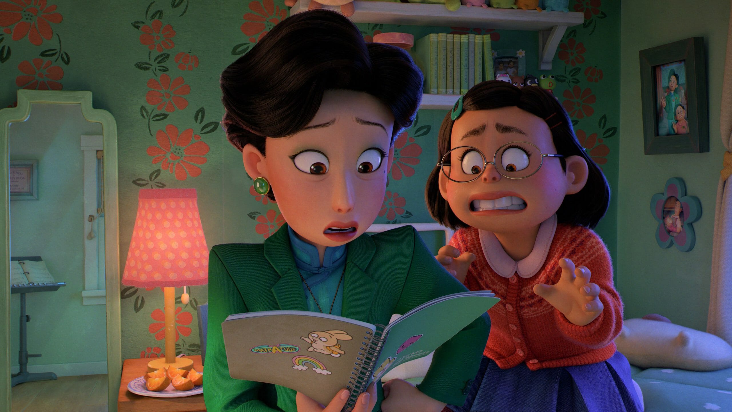 Mie Lee looks in distress as her mother Ming looks over her personal notebooks and diary as seen in the new Pixar film TURNING RED streaming on Disney+.