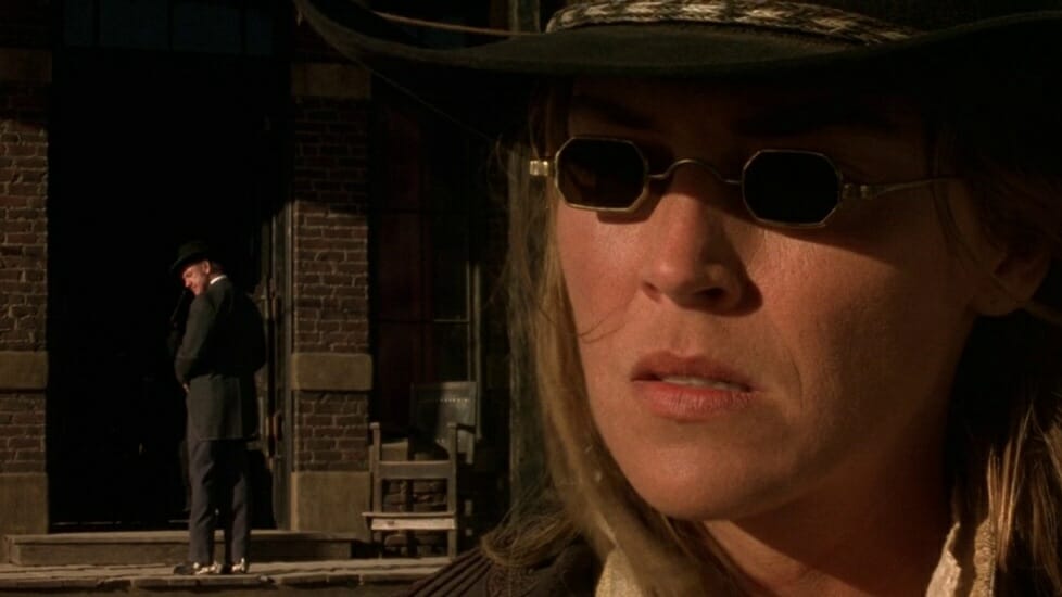 Sharon Stone as "The Lady" rocks sunglasses as her and Gene Hackman prepare for a classic Western stand-off in THE QUICK AND THE DEAD directed by Sam Raimi.  