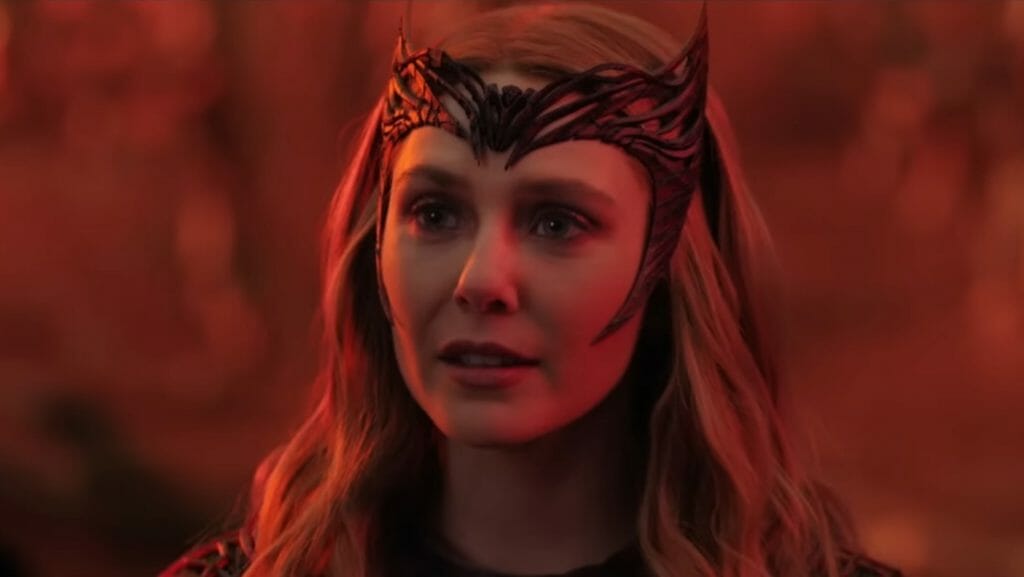 Elizabeth Olsen as the Scarlet Witch stands in a blazed fire red wasteland in DOCTOR STRANGE IN THE MULTIVERSE OF MADNESS written by Michael Waldron and directed by Sam Raimi. 