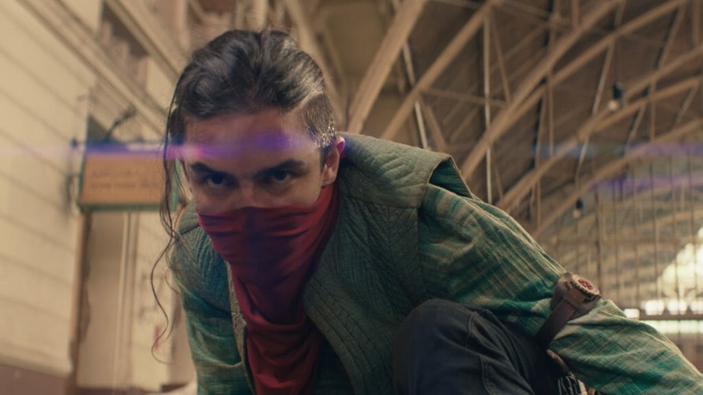 Aramis Knight strikes an action pose in full costume as the Red Dagger in the MCU Disney+ series MS. MARVEL.