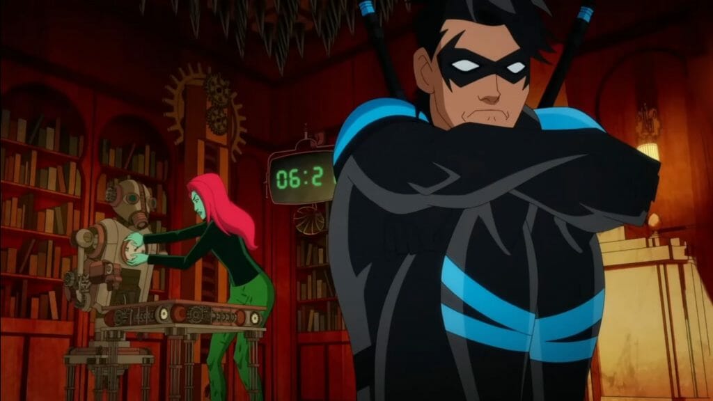 Nightwing cradles up in fetal position and frowns in despair as Poison Ivy tries to save them from dying in the Riddler's trap escape room in HARLEY QUINN Season 3. 