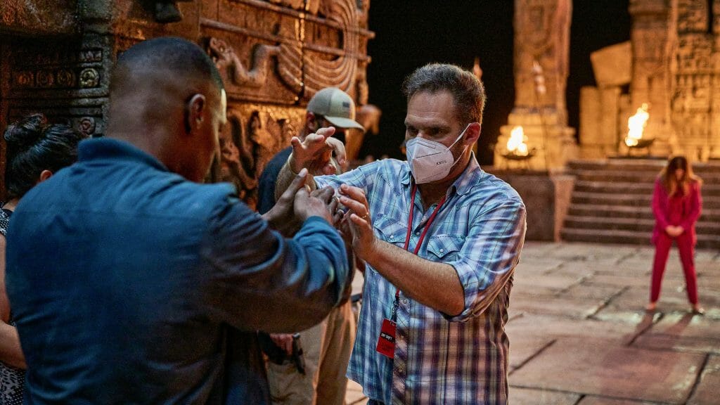 Director JJ Perry blocks a scene with star Jamie Foxx in an ancient Vampire temple on the set of the Netflix action comedy DAY SHIFT. 