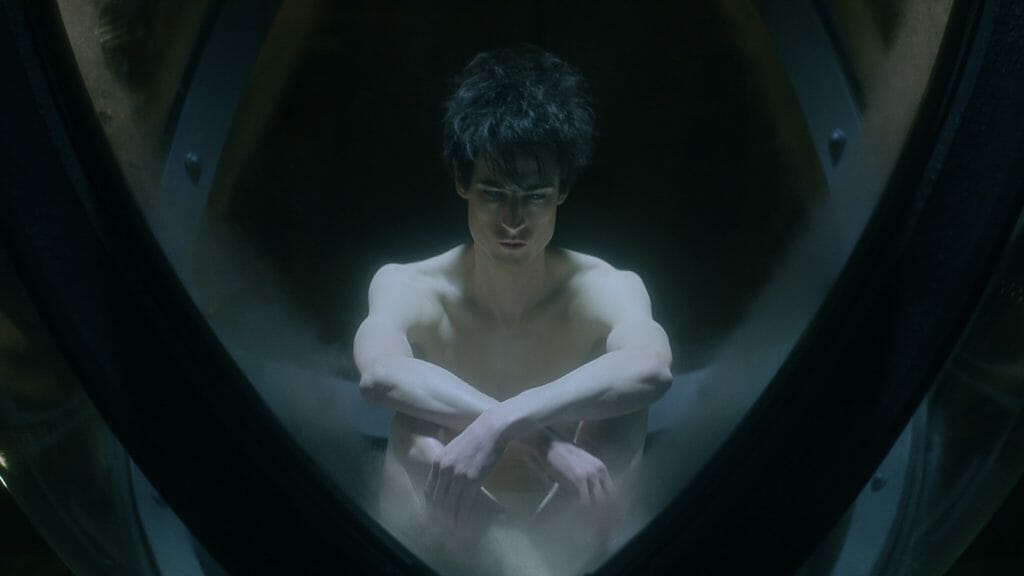 ‘The Sandman’ Review – Perplexing in Mostly the Right Ways Morpheus aka Dream played by Tom Sturridge meditates shirtless in his magical orb prison where he can't use his dream abilities and is dreamed powerless in THE SANDMAN on Netflix.