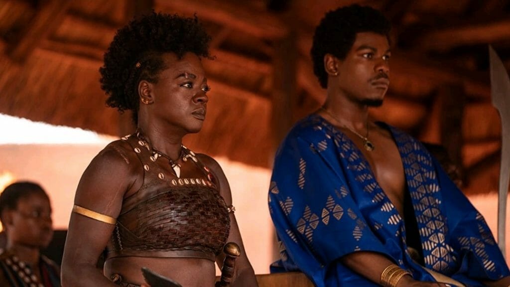 Viola Davis as the Agojie general Nanisca next to King Ghezo played by John Boyega overlooking the Dahomey empire from THE WOMAN KING.