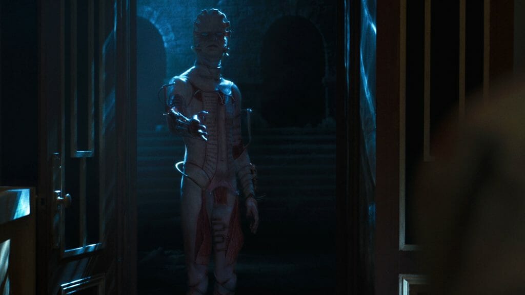 A new cenobite referred to as The Masque, looking like a meatless body and face with dry skin stretched over wire, reaches out to a new victim in the HELLRAISER reboot streaming only on Hulu. 