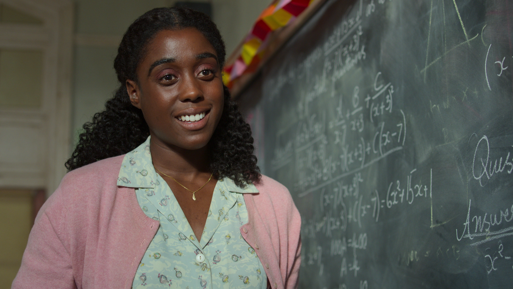 Lashana Lynch stars as Miss Honey teaching in the classroom in Roald Dahl's Matilda The Musical on Netflix. 