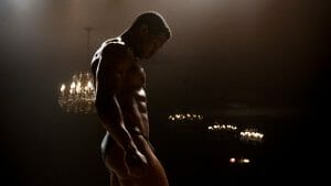 Jonathan Majors stars as the aspiring bodybuilder Killian Maddox posing and showing off his muscles wearing a speedo in MAGAZINE DREAMS.