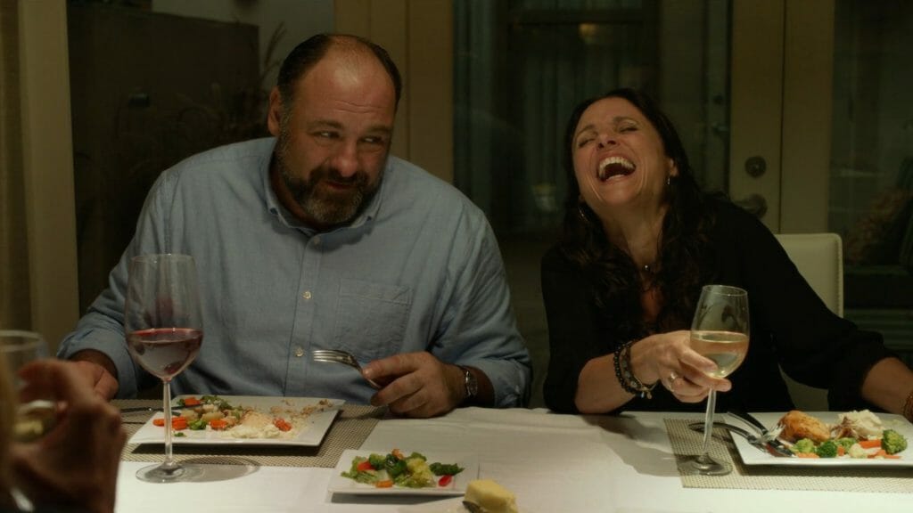 James Gandolfini and Julia Louis-Dreyfus share a laugh over dinner in the romantic comedy ENOUGH SAID on Hulu, one of our Valentine's Day films to stream for February 2023.