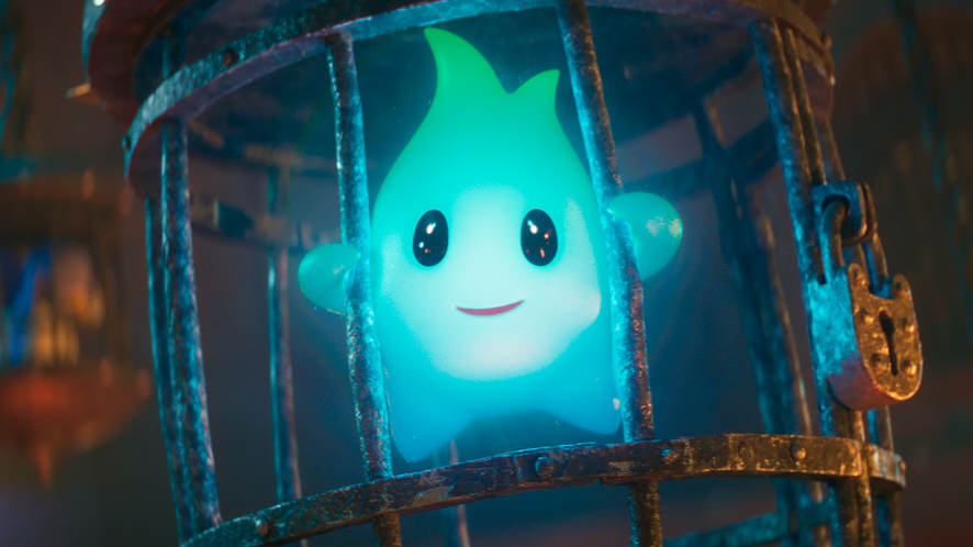 The nihilistic little blue luma star named Lumalee voiced by Juliet Jelenic smiles happily from her cage in Bowser's prison in THE SUPER MARIO BROS. MOVIE. 