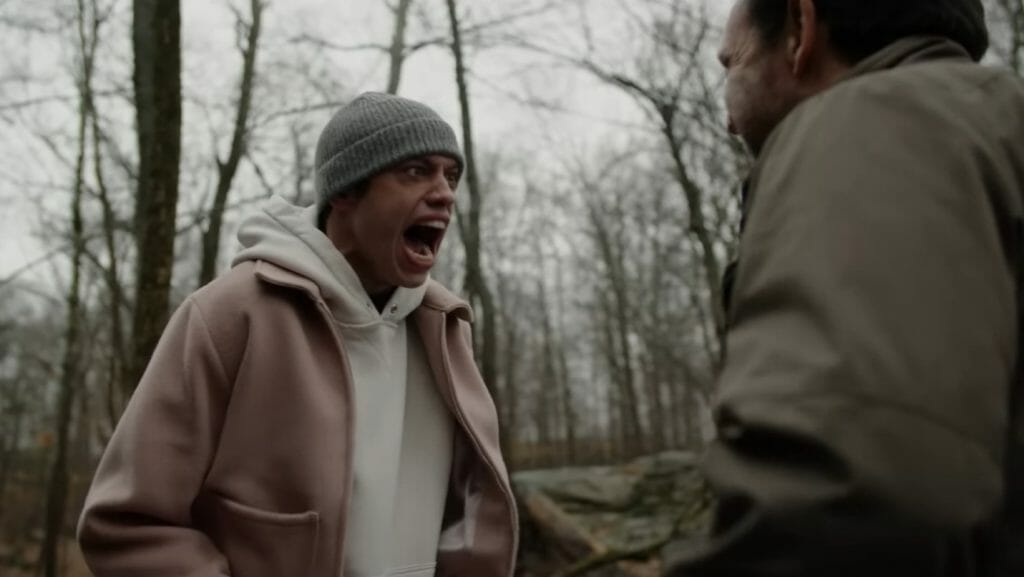 Pete Davidson yells his lungs out in the middle of a forest as a form of therapy in the semi-autobiographical comedy series BUPKIS streaming on Peacock. 