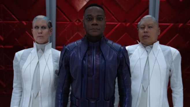 Chukwudi Iwuji stars as the High Evolutionary with two of his enhanced cyborg recorder servants standing at his sides in GUARDIANS OF THE GALAXY VOL. 3