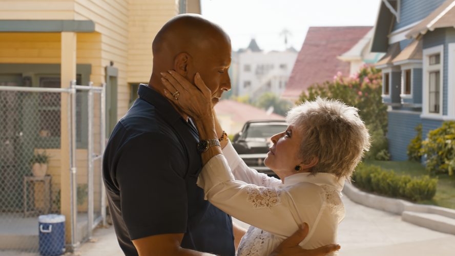 Vin Diesel as Dominic Toretto is embraced by his abuelita played by Rita Moreno as she gives him life and family advice in FAST X. 