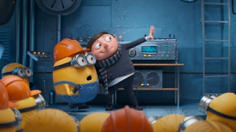 Young kid Gru has a meeting with his new yellow minions all wearing orange hard hats in MINIONS: THE RISE OF GRU from Illumination.