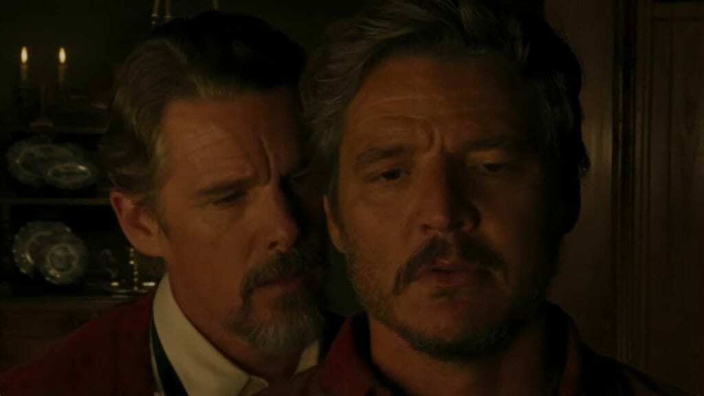 Ethan Hawke as Sheriff Jake comes in for a kiss from behind of Silva a rancher played by Pedro Pascal in the short film STRANGE WAY OF LIFE.