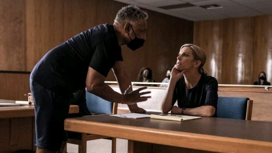 Giancarlo Esposito talks to actress Rhea Seehorn in a courtroom scene as the director of the BETTER CALL SAUL Season 6 episode titled Axe and Grind.