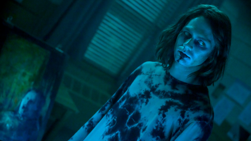 Dalton Lambert played by Ty Simpkins looks possessed by a demon with slime all over his face in INSIDIOUS: THE RED DOOR.