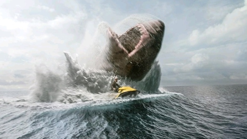 Jason Statham escapes the jaws of a giant Megalodon jumping out of the ocean while riding on a Jet Ski in MEG 2: THE TRENCH. 