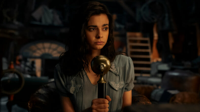 Aria Mia Loberti stars as the blind French girl Marie-Laure LeBlanc speaking into a microphone for her illegal radio broadcast during WWII in the Netflix original limited series ALL THE LIGHT WE CANNOT SEE.